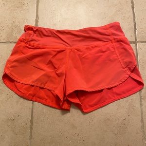lululemon size 2 shorts (neon orange/red)
